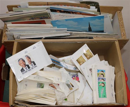 A box of World stamps, in display packers and loose pages and various postcards